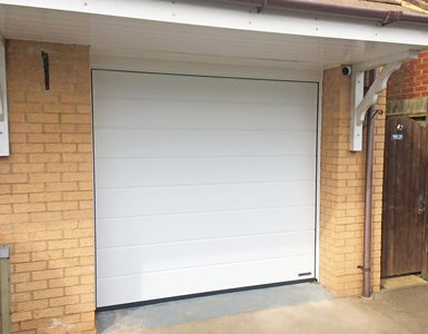 Double Skin Sectional Garage Door in White, Medium Ribbed Design 